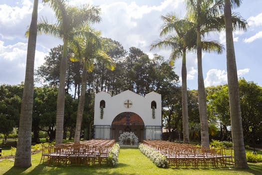 Beautiful outdoor wedding setting with palm trees and a chapel in São Paulo, Brazil.