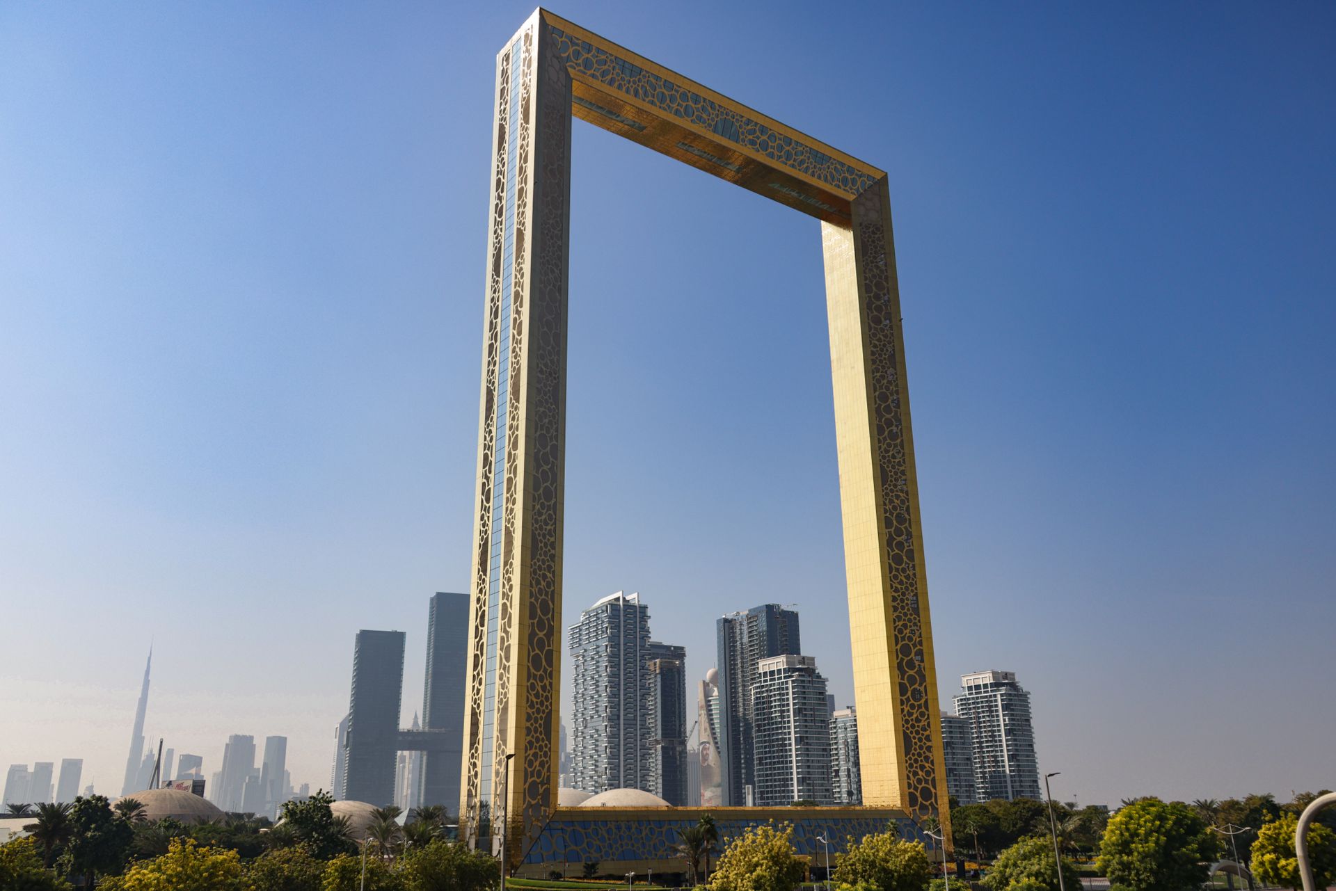 The iconic Dubai Frame stands tall with a modern cityscape backdrop, showcasing architectural brilli