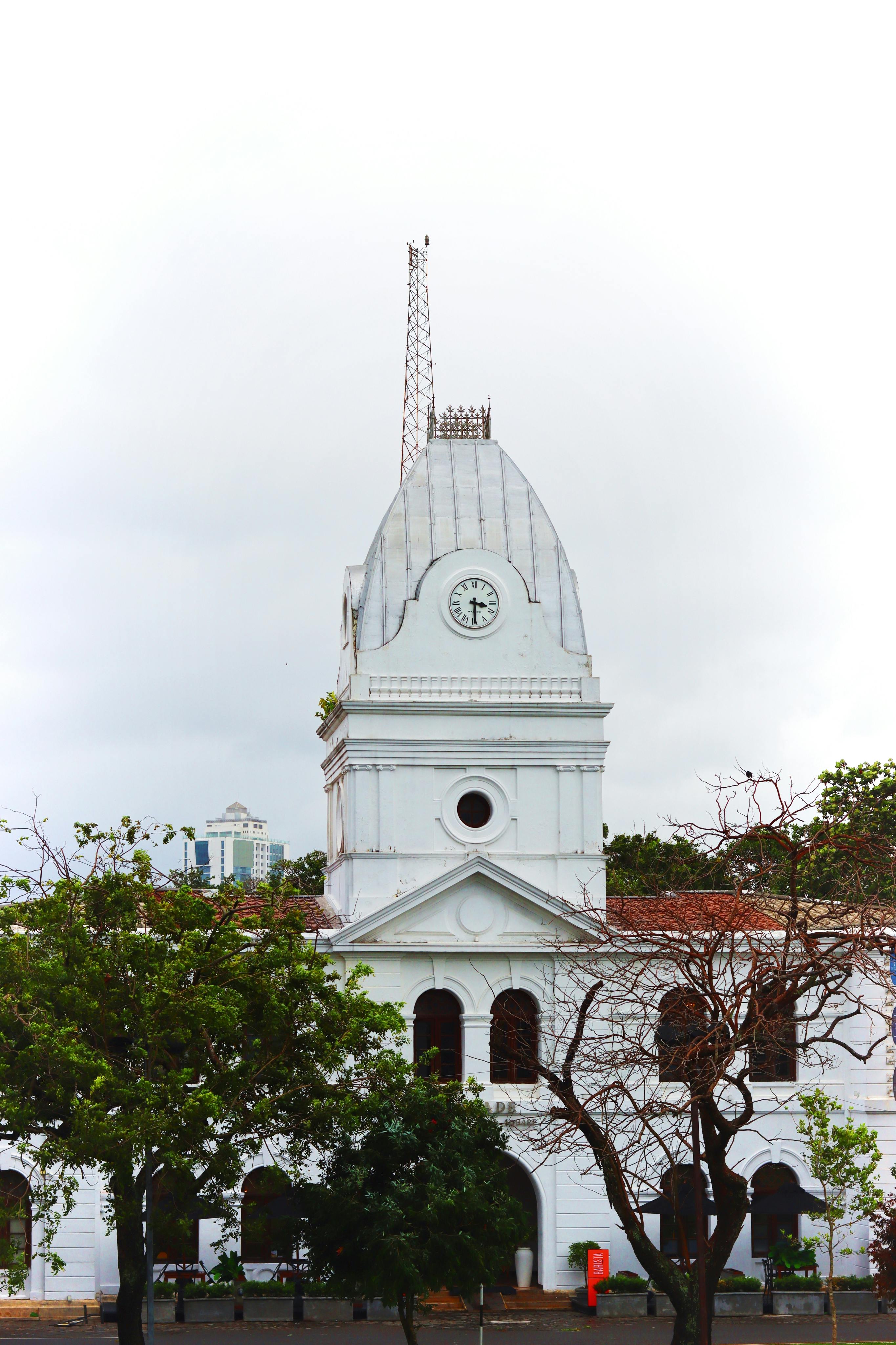 Historic Colombo Clock Tower with colonial architecture in a vibrant cityscape setting.