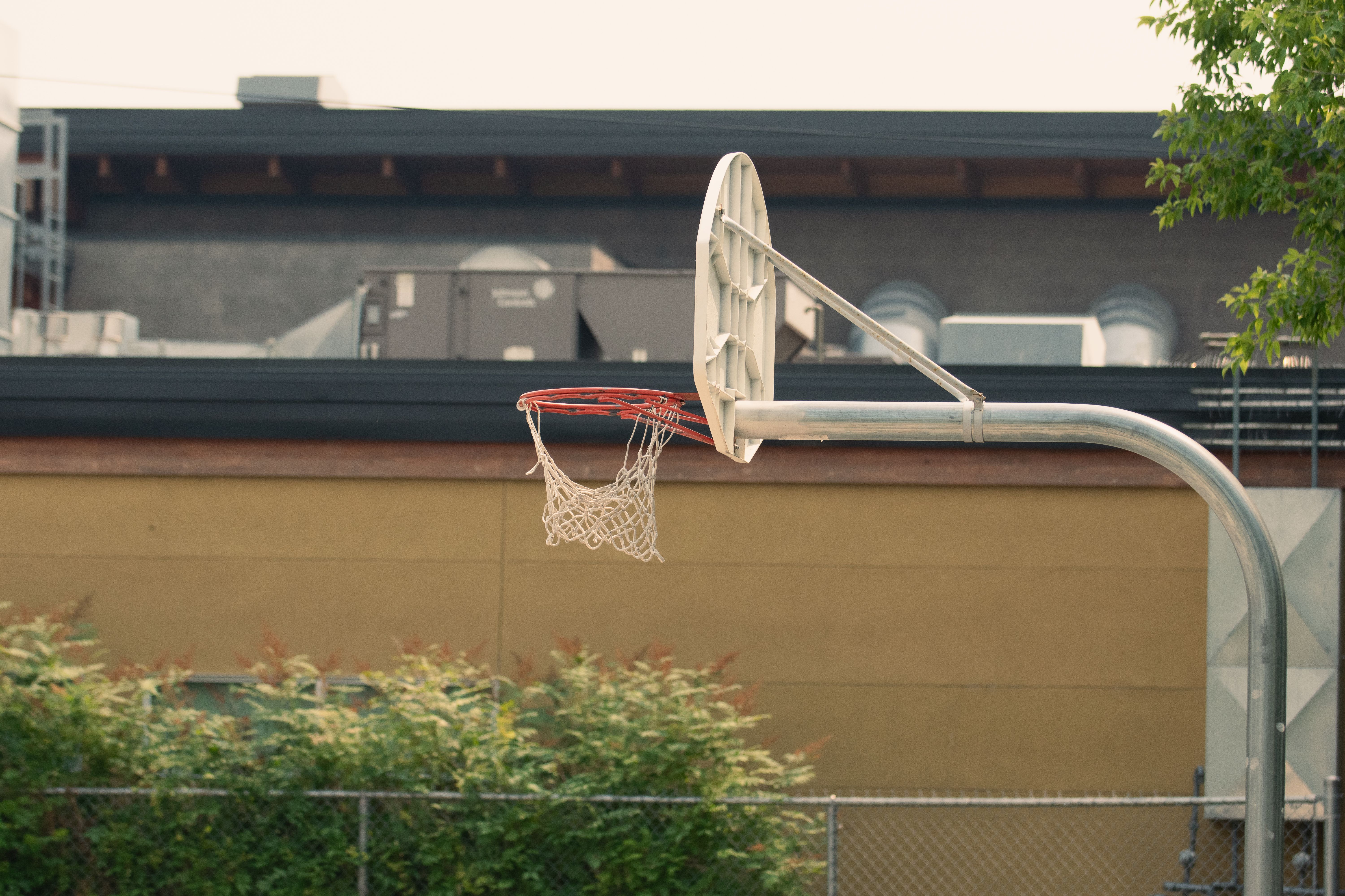 Outdoor Basketball Hoop in Urban Setting · Free Stock Photo
