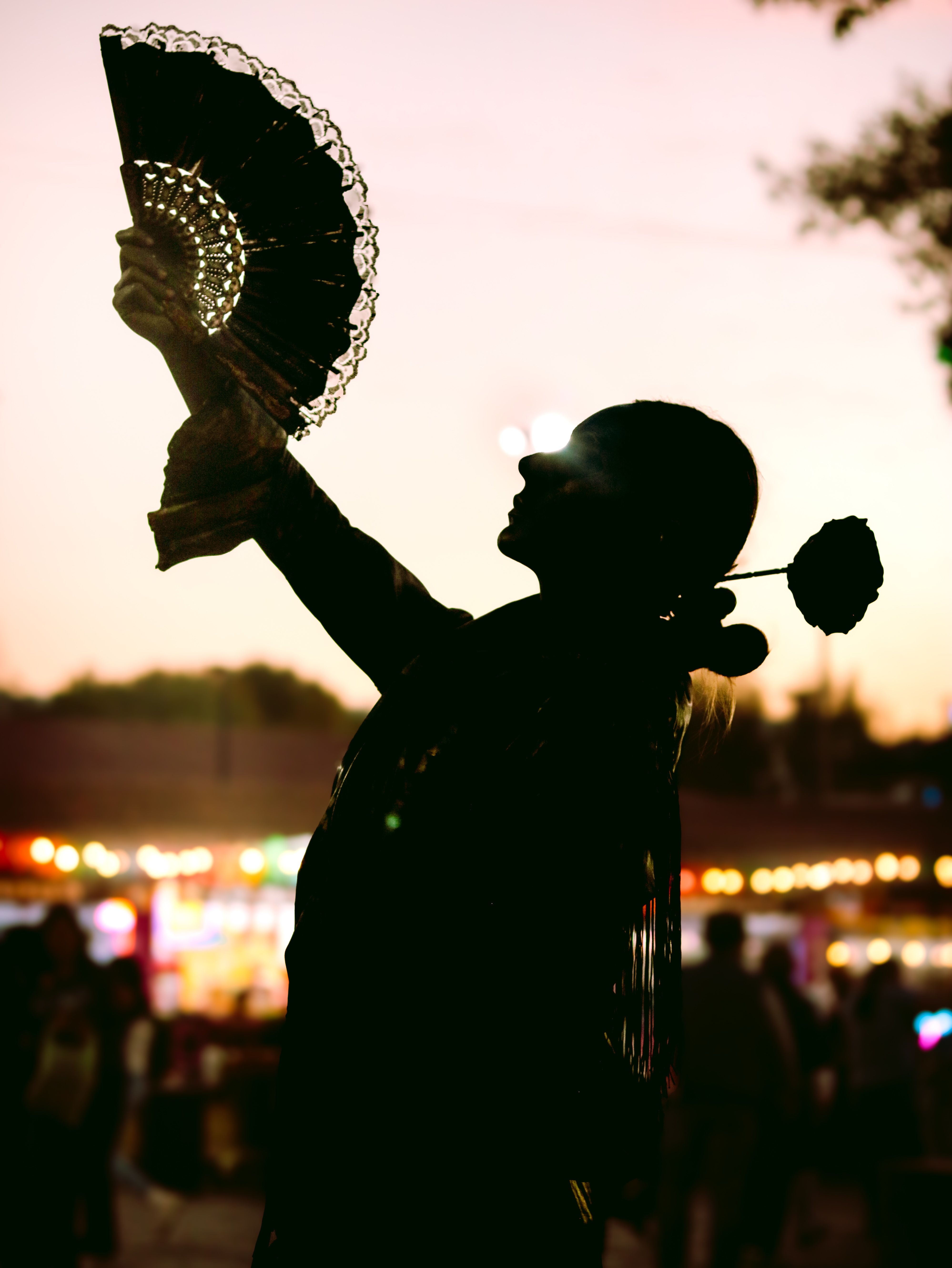 Silhouette of Dancer with Fan at Sunset · Free Stock Photo
