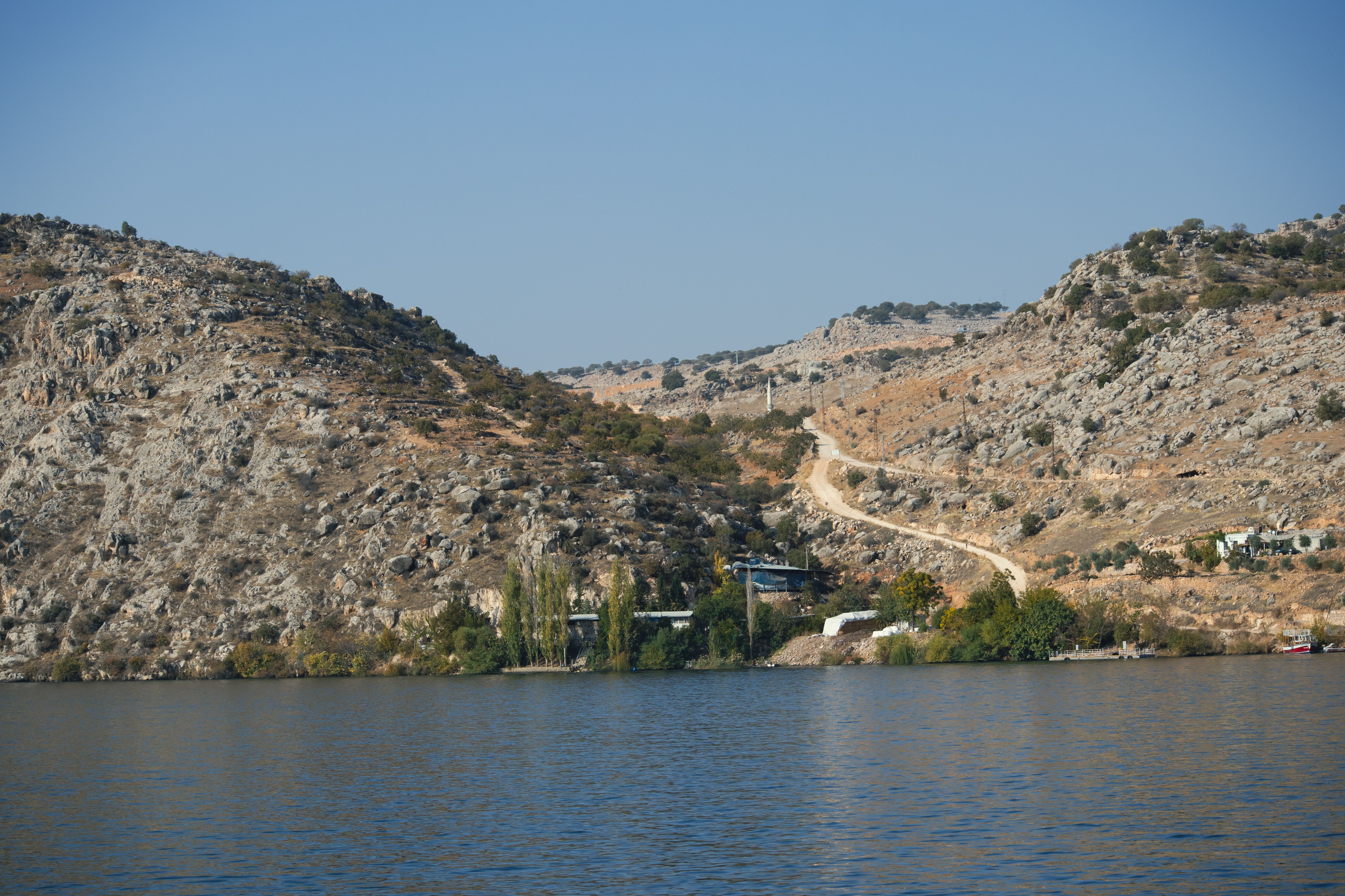 Scenic view of rocky hills and calm waters in Halfeti, Türkiye.