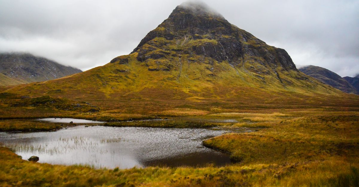 Breathtaking view of a mountain in Glen Coe, Scotland during an autumn day.