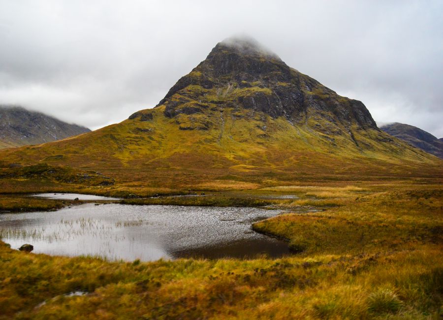 Breathtaking view of a mountain in Glen Coe, Scotland during an autumn day.
