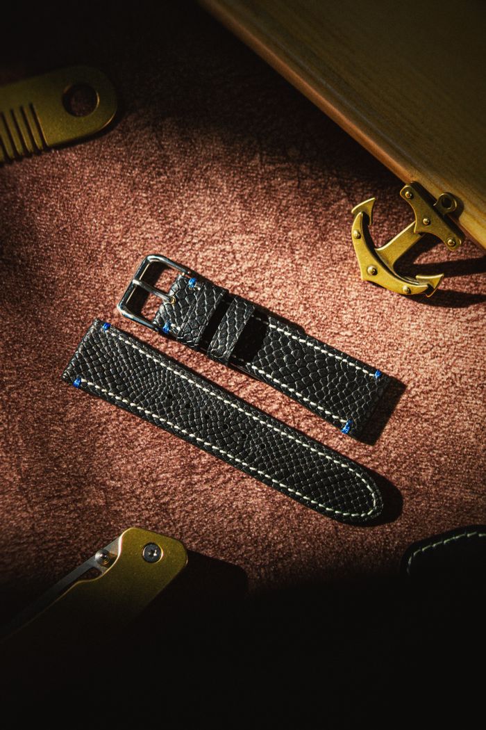 Hand-stitched leather strap on a workbench, photo by Atelier Kommpass on Pexels
