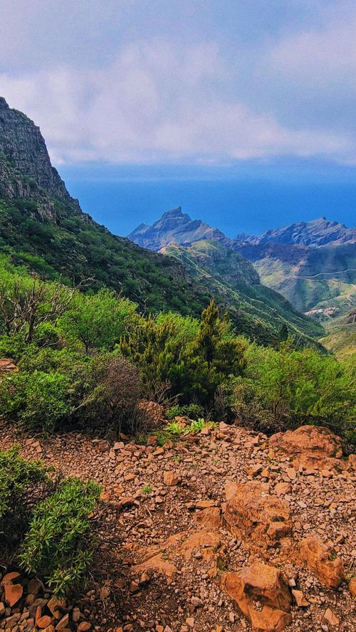 Free Stunning view of green mountains and the ocean from Tenerife, Spain. Stock Photo