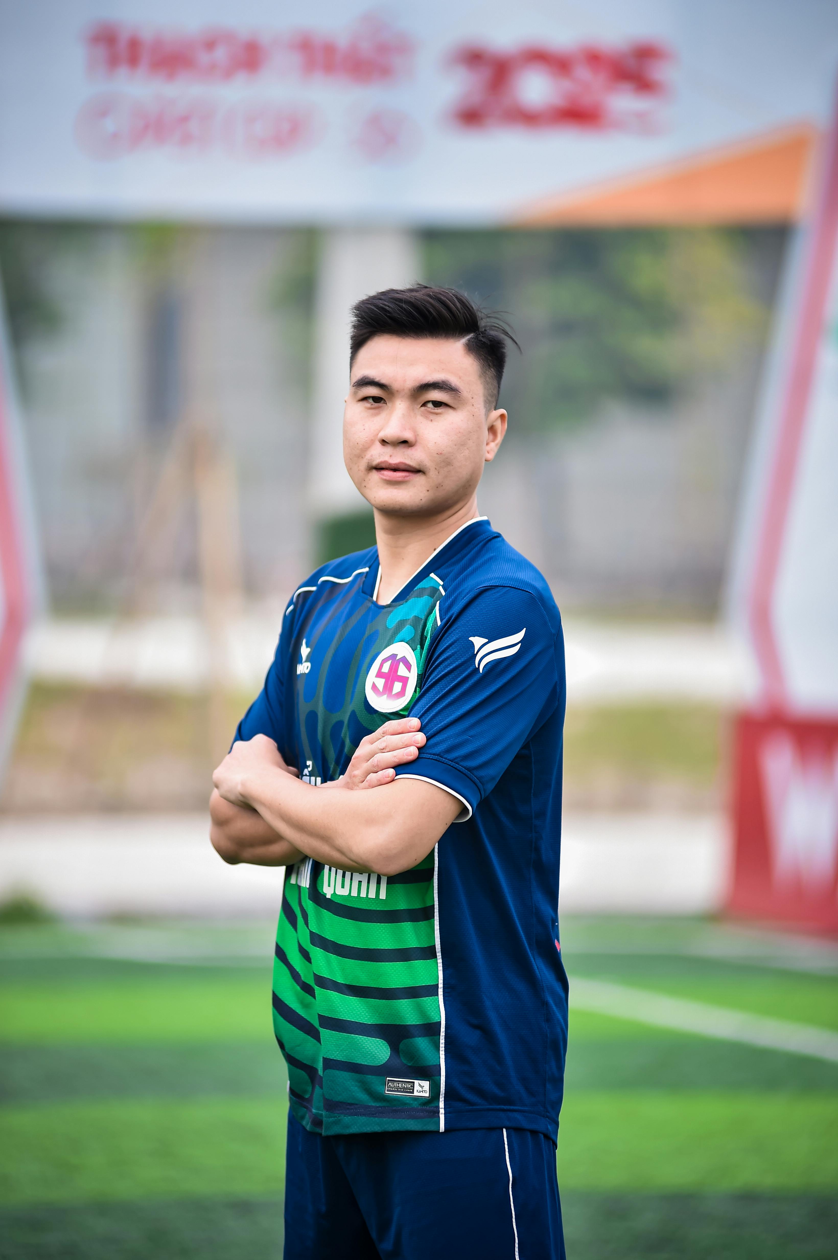 Portrait of a football player on a field in Hanoi, emphasize on sportsmanship.