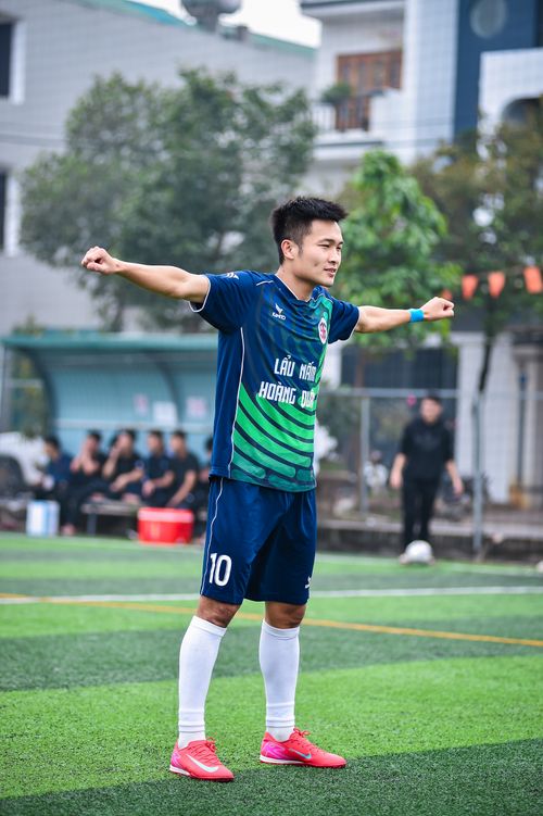 Free Football player warming up on an artificial turf field in Hanoi, Vietnam. Stock Photo
