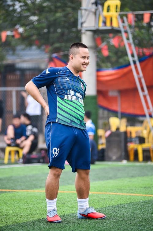 Free Young man enjoying a football game on an artificial turf field in Hanoi, Vietnam. Stock Photo