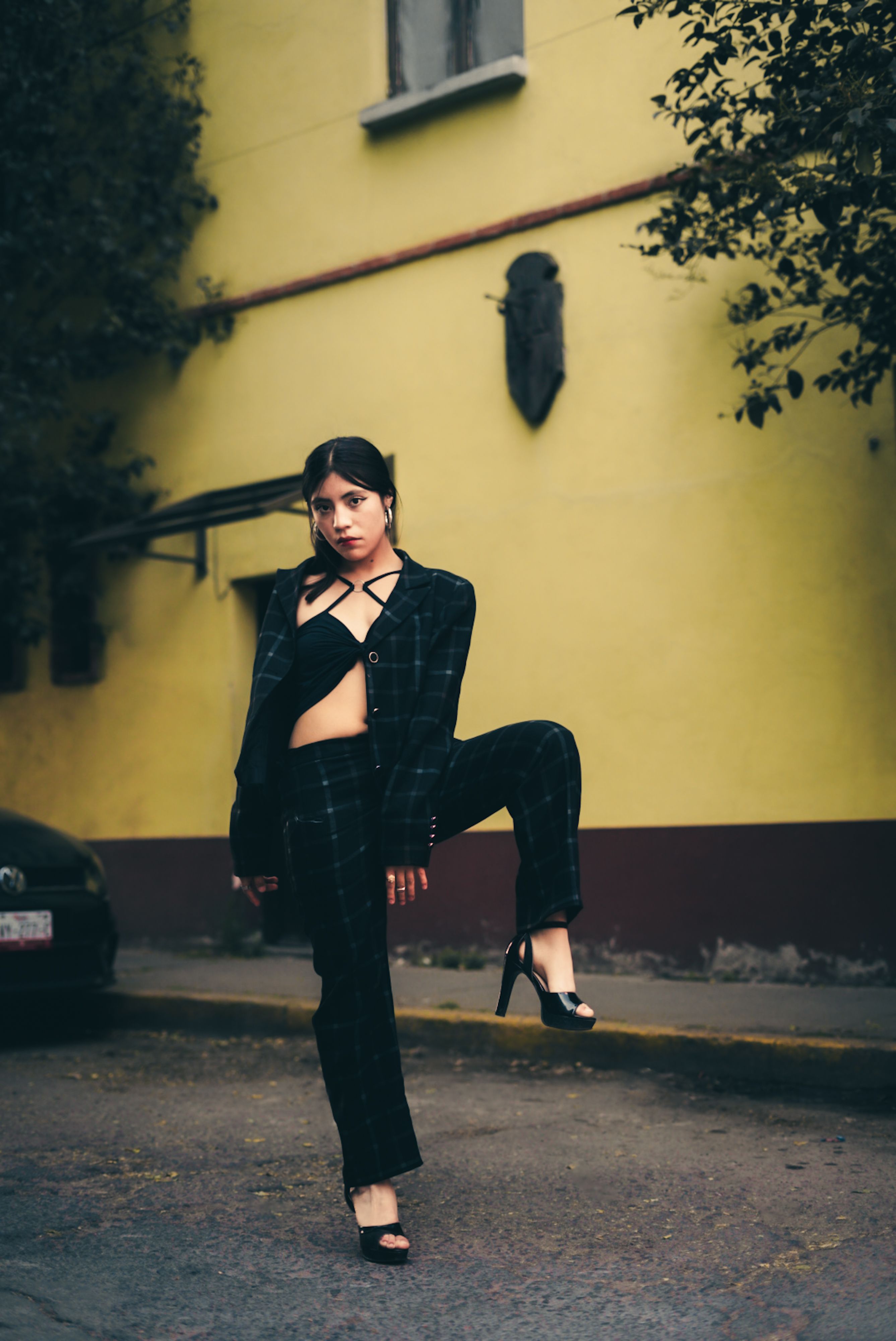Stylish Woman Posing Outdoors in Urban Setting · Free Stock Photo