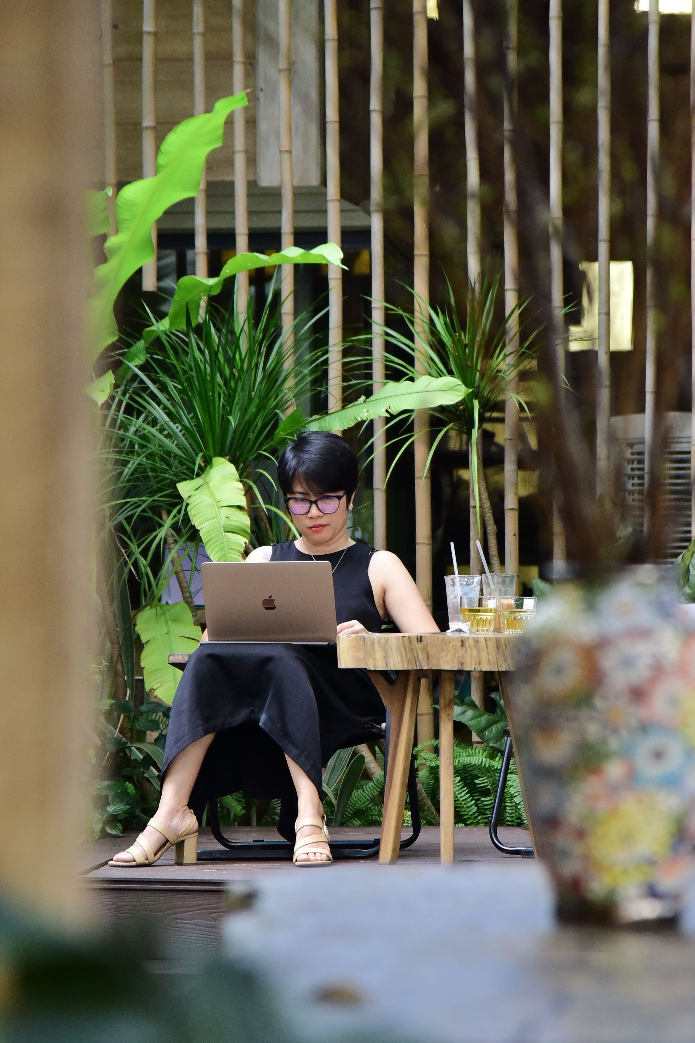Woman Working Outdoors in Garden Setting