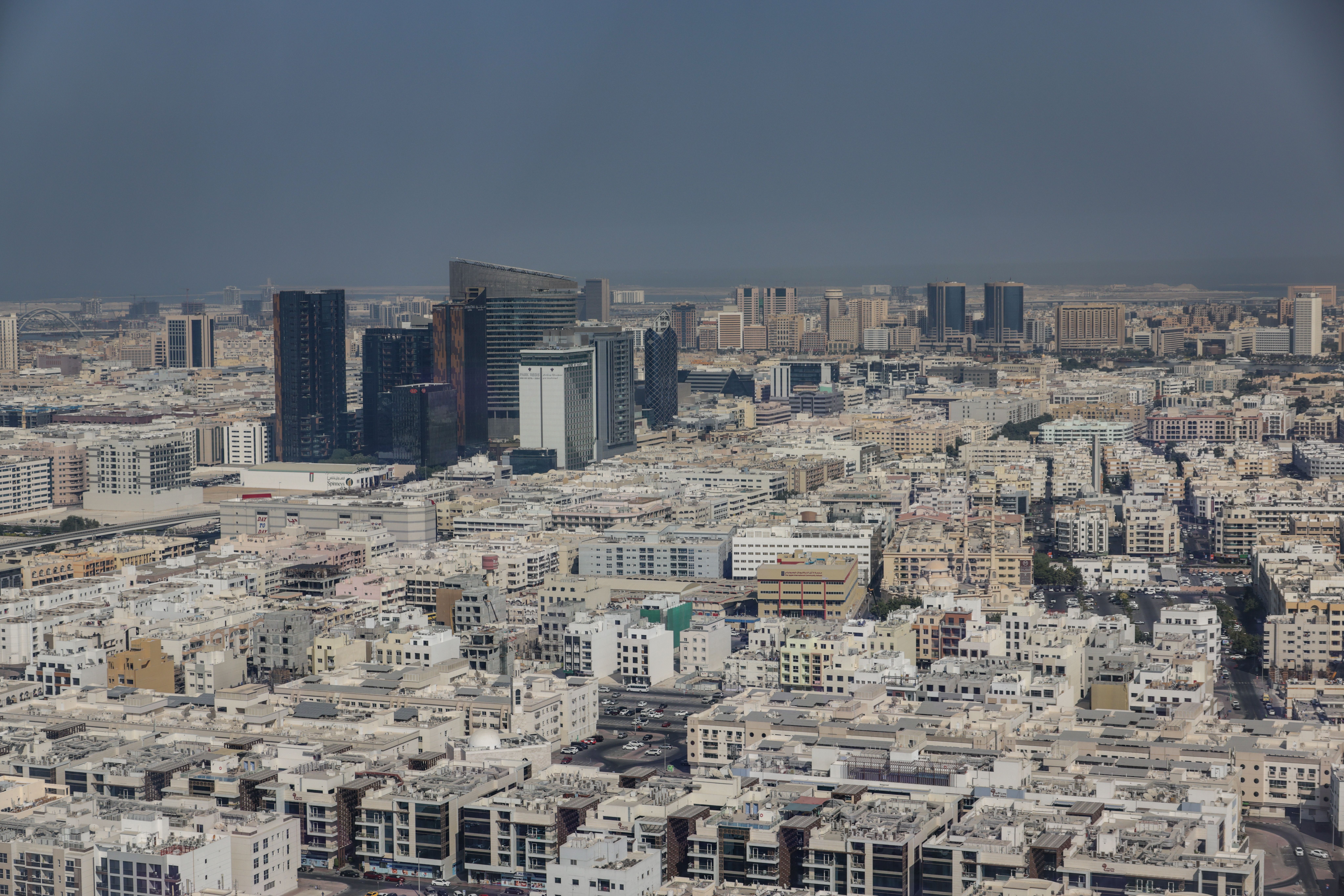 A stunning aerial view showcasing the contrast between modern skyscrapers and historic buildings in 
