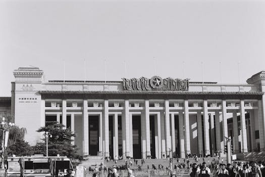 Monochrome image showcasing the National Museum of China with historical architecture and crowd.