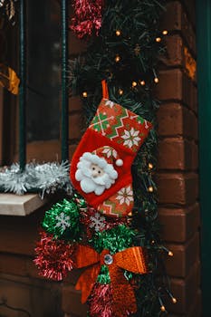 Vivid red Christmas stocking with Santa decoration on a brick wall in İstanbul, Türkiye.