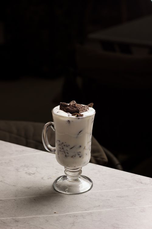 Free A delicious Oreo milkshake in a glass cup, perfect for dessert lovers. Stock Photo