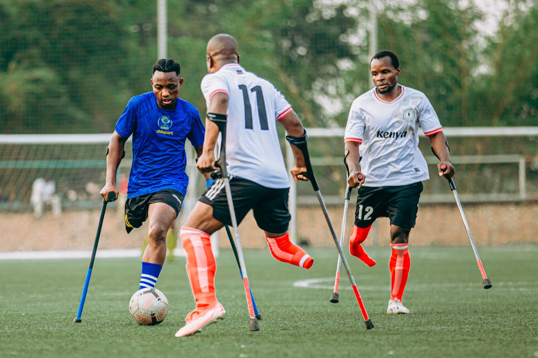 Passionate amputee footballers compete on a field, showcasing sportsmanship and determination.
