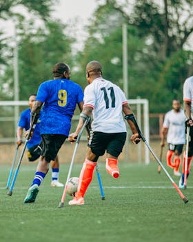 Dynamic image of amputee soccer players in action on the field.
