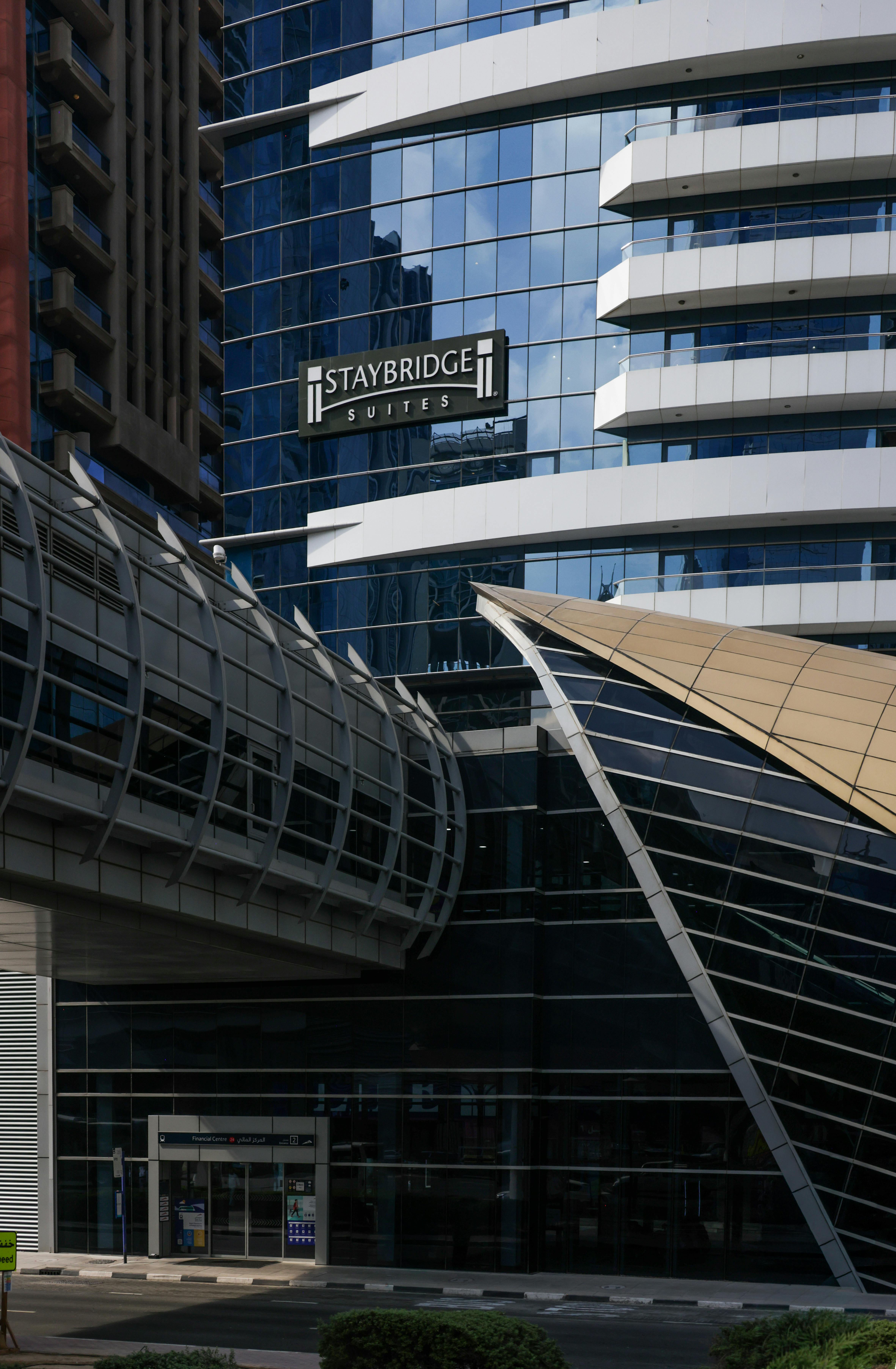 Contemporary architecture of Staybridge Suites with glass facade and geometric designs.