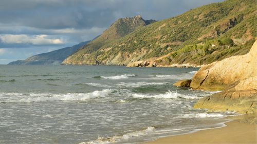 Free Beautiful coastal view of the rocky beach in Farinole, Corsica, on a sunny day. Stock Photo