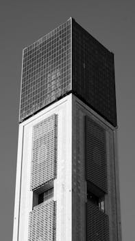 A striking monochrome image of modern tower architecture in Algiers, showcasing intricate design.