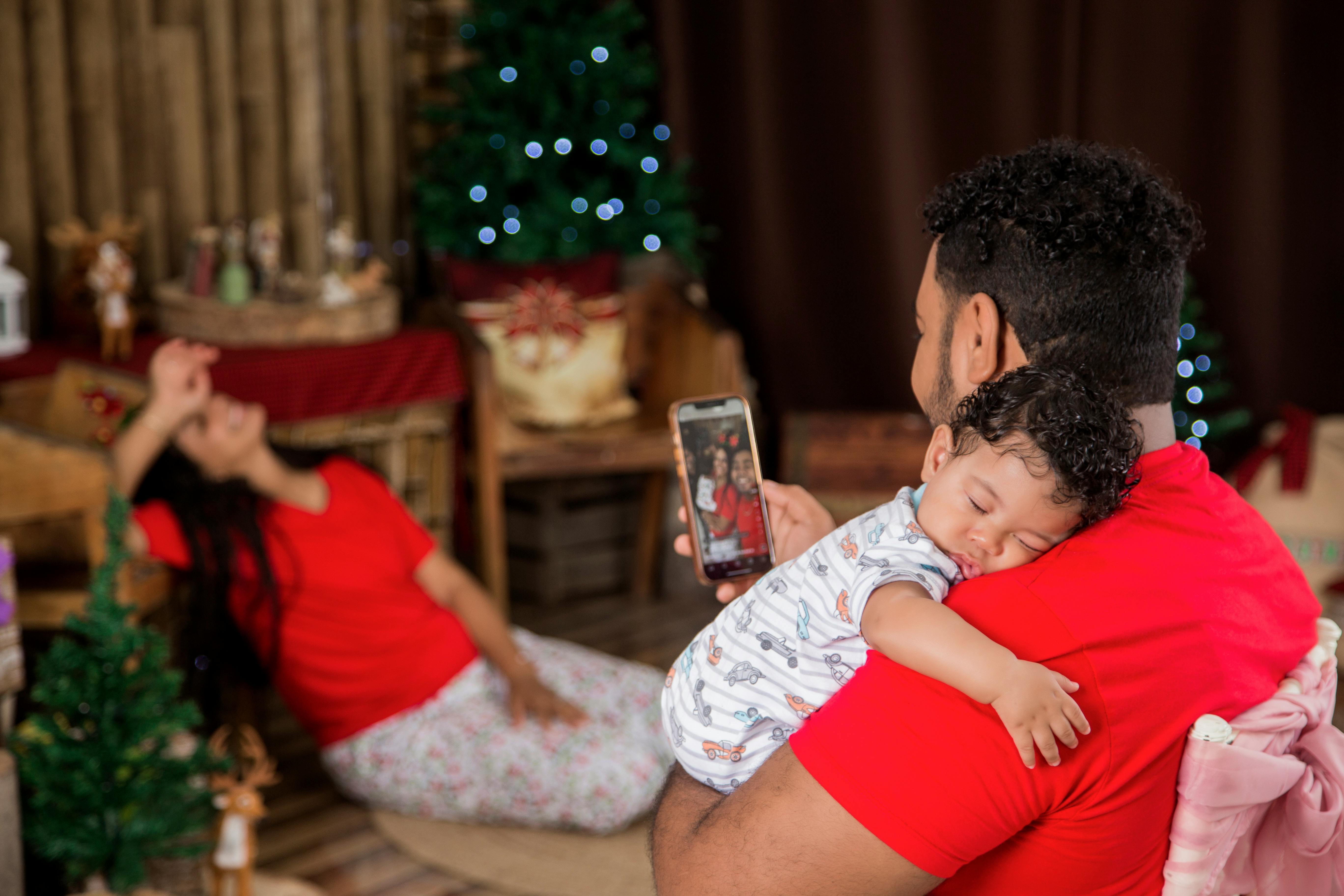 Father and child enjoying a serene Christmas moment in Puerto Plata, Dominican Republic.