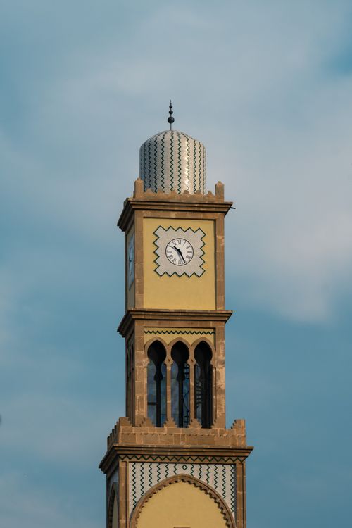 Free A picturesque clock tower in Casablanca, Morocco against a clear blue sky, showcasing Moroccan architecture. Stock Photo