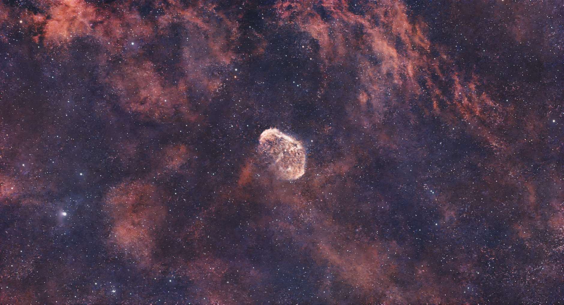 Vibrant photo of the Crescent Nebula amidst a colorful cosmic landscape.