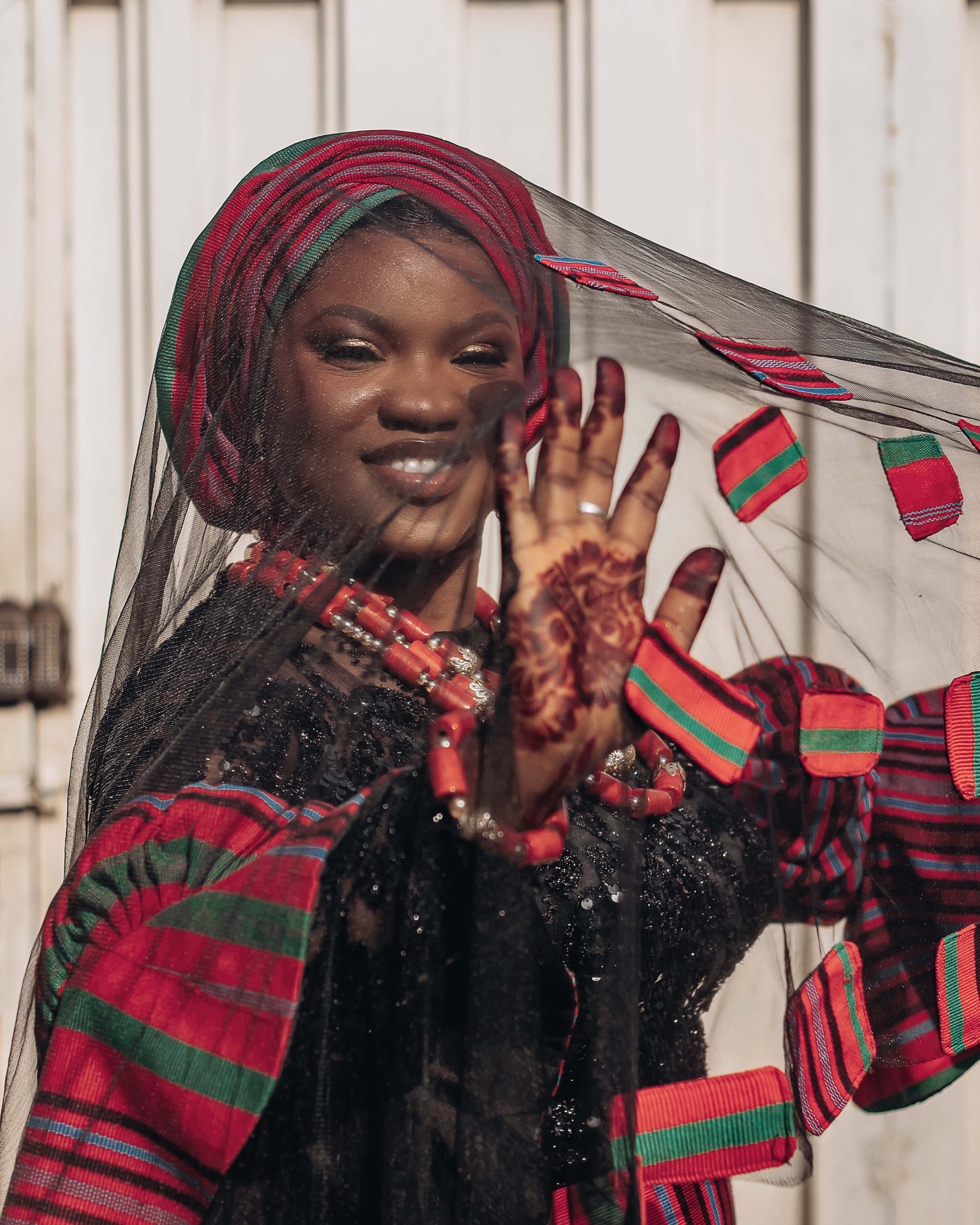 Joyful African Woman in Traditional Attire · Free Stock Photo
