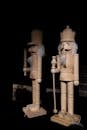 Wooden Nutcracker Figures in Shadowy Setting