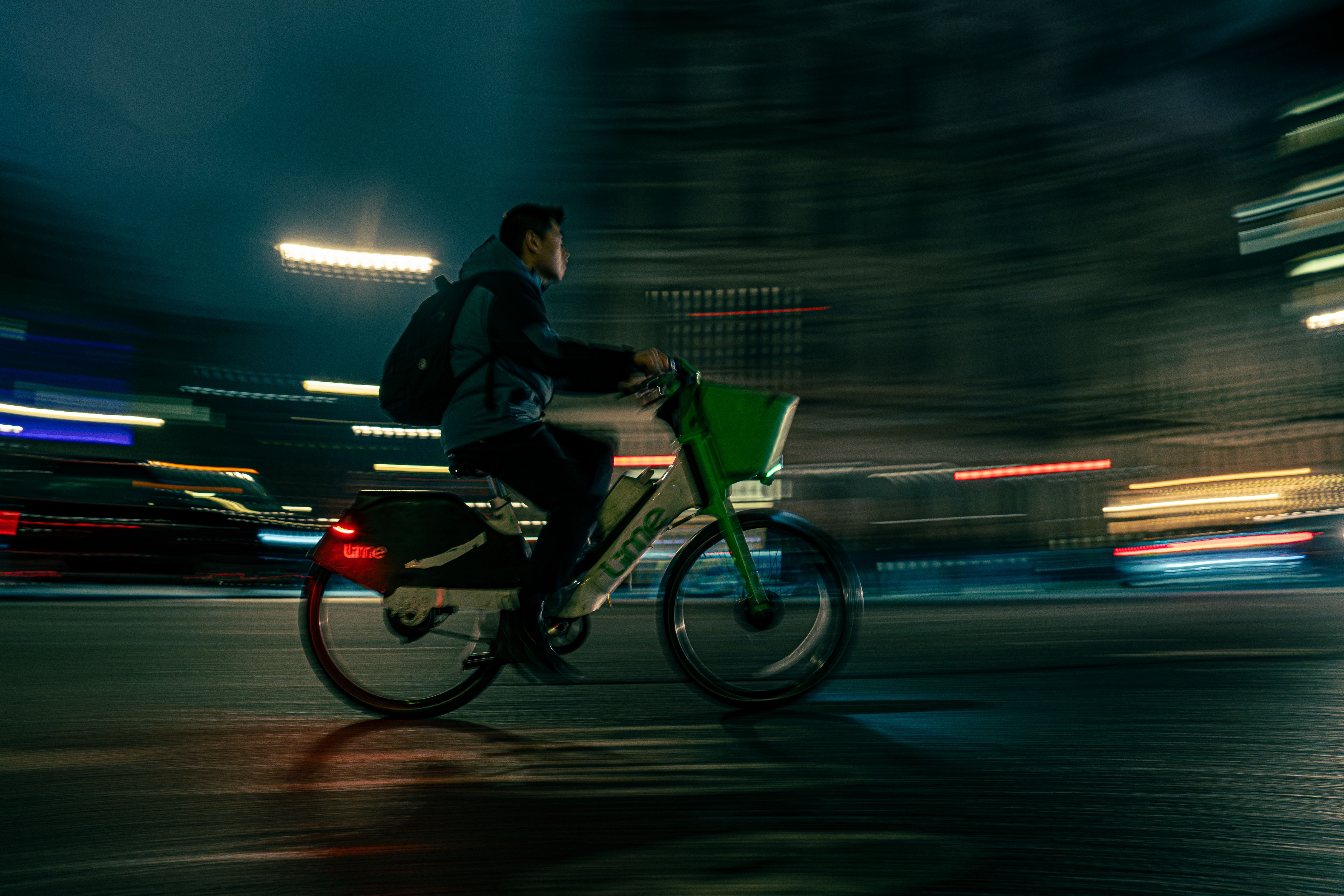 Nighttime Urban Biking with Motion Blur · Free Stock Photo