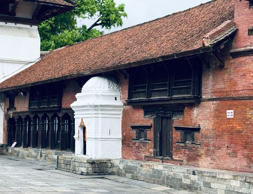 Free Traditional red brick architecture with unique wooden carvings in Kathmandu Durbar Square, Nepal. Stock Photo