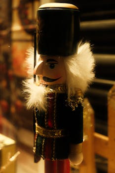 A festive close-up of a traditional nutcracker soldier with golden details.