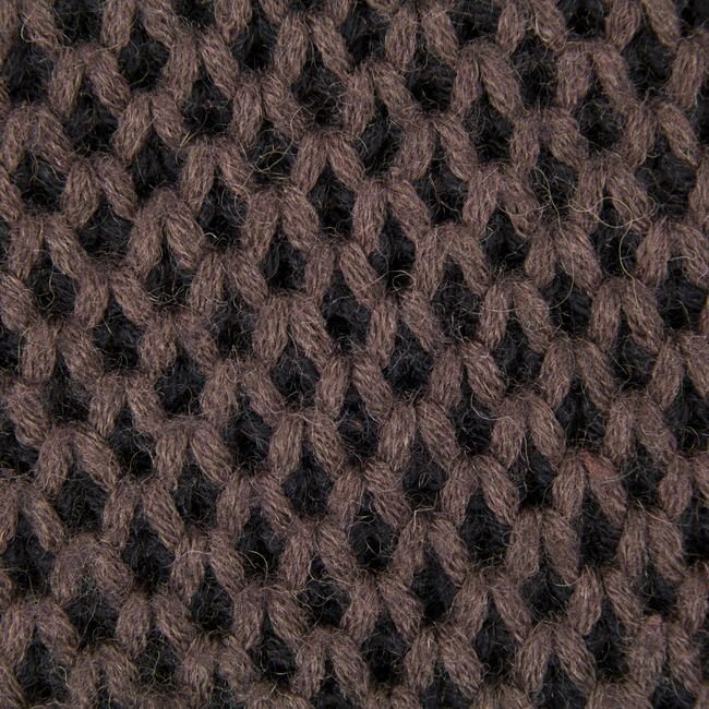 Detailed close-up of a brown and black knit fabric texture, perfect for showcasing material design.