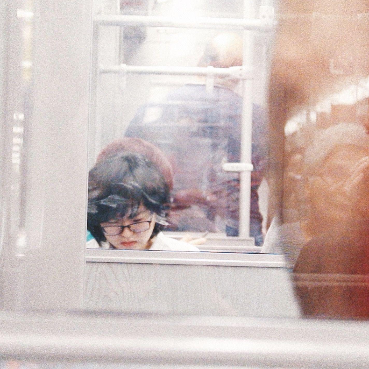 Woman Wearing Eyeglasses Reflection on Mirror