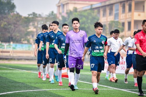 Free A group of young football players entering an outdoor soccer field in Hà Nội, Việt Nam. Stock Photo