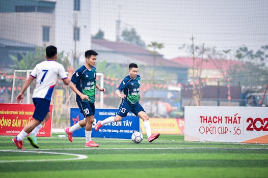 Action-packed moment during Thach That Open Cup soccer match in Hà Nội, Việt Nam.
