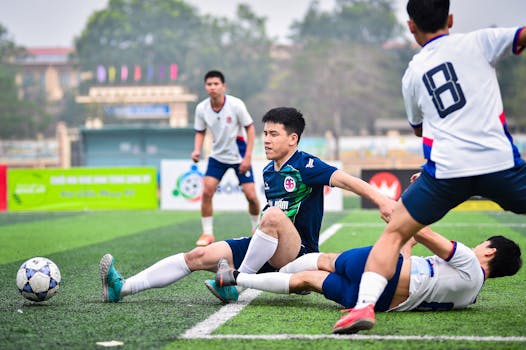 Dynamic soccer match in Hanoi capturing players' determination on the field.