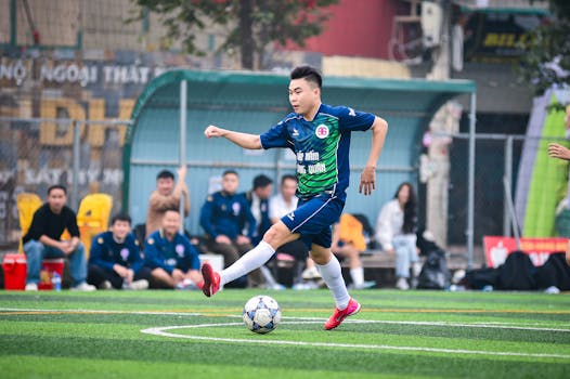 An athlete skillfully plays soccer during a match in Hà Nội, Việt Nam.