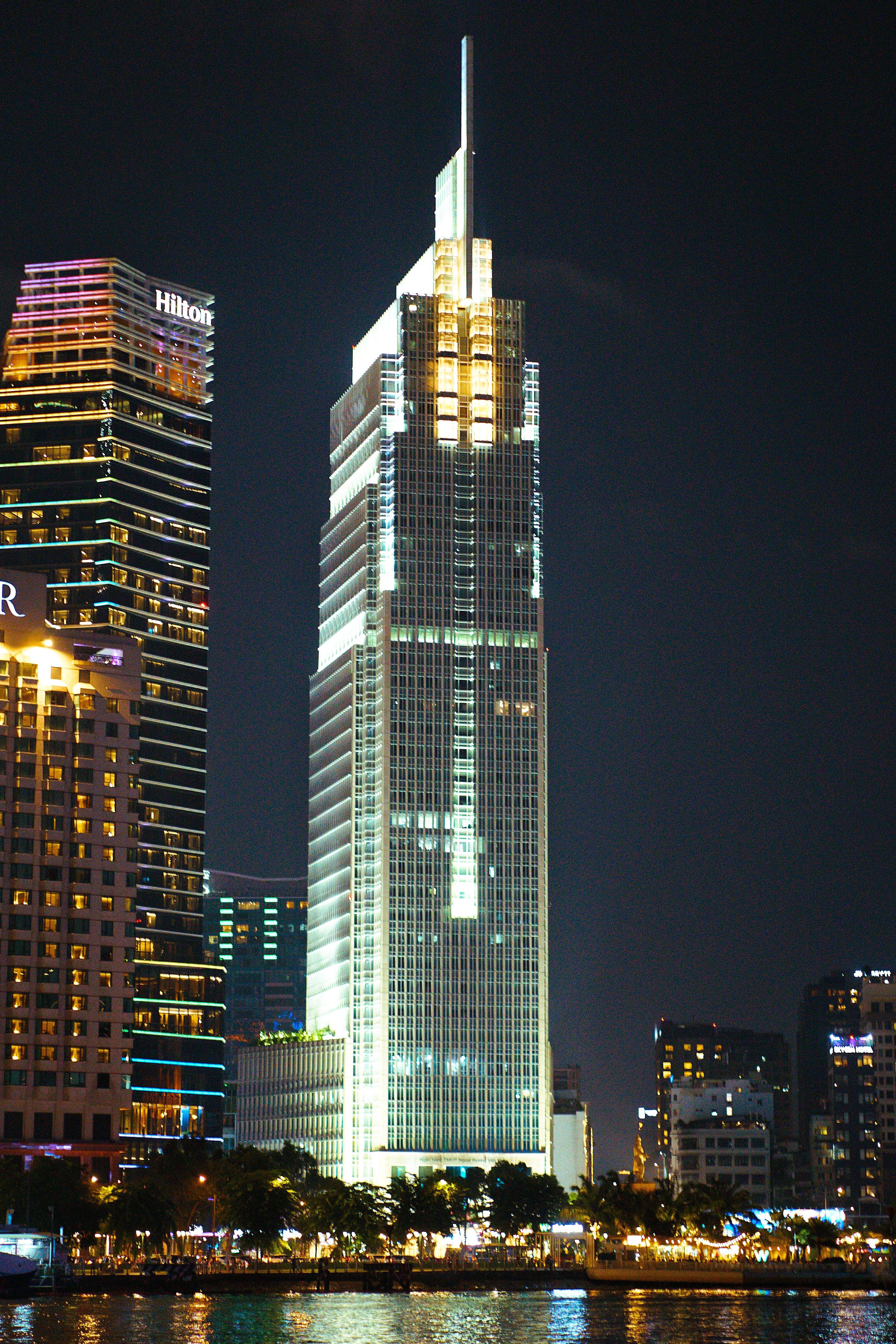 Illuminated Skyscraper in City Skyline at Night · Free Stock Photo