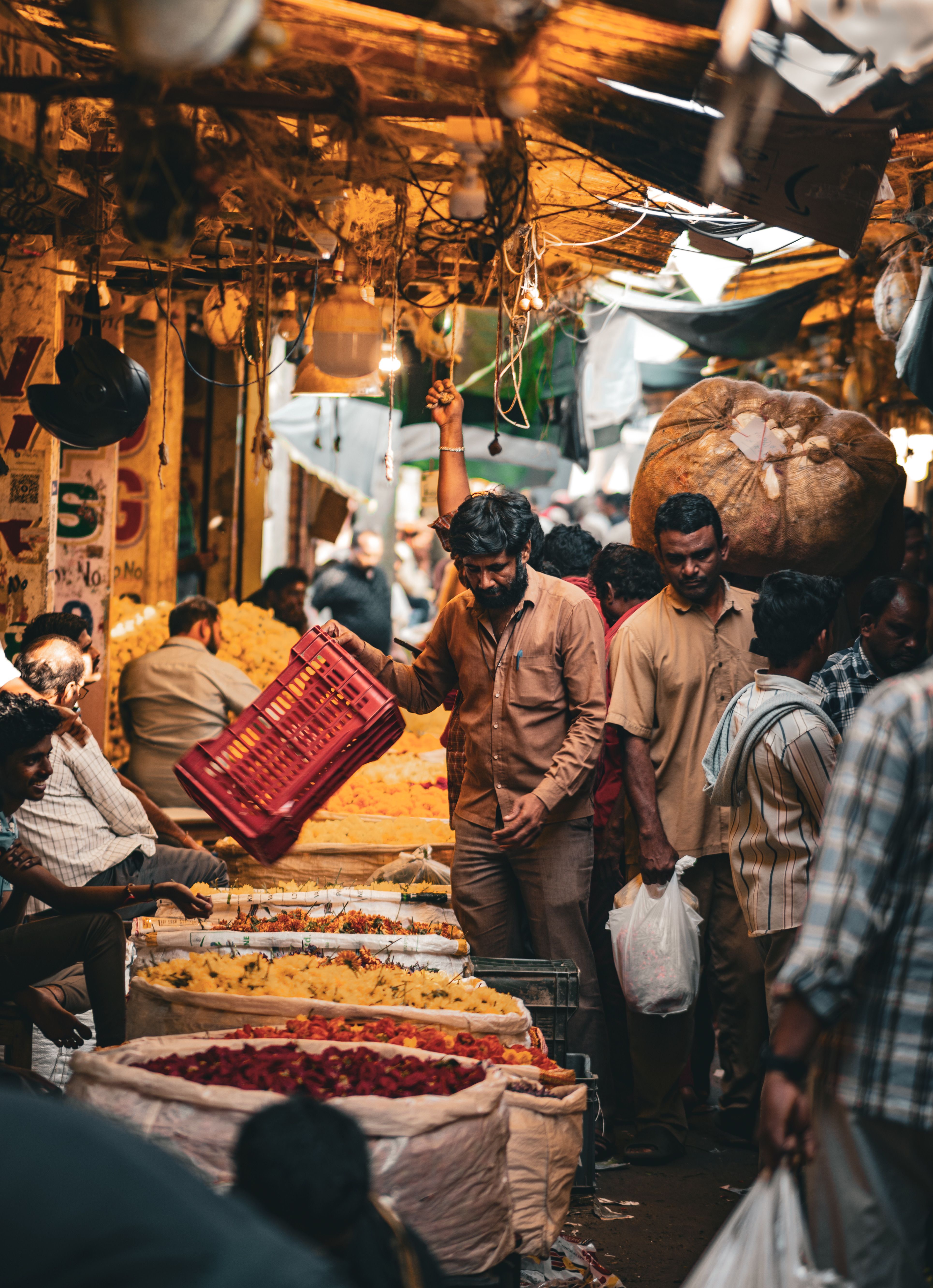 Vibrant scene of a busy flower market in Vijayawada, showcasing local culture and daily life.
