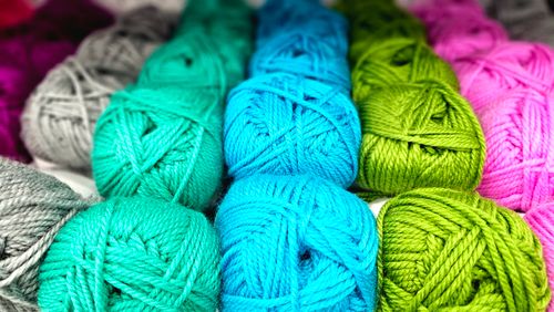 Free Vibrant yarn balls in various colors ideal for knitting and crochet. Stock Photo