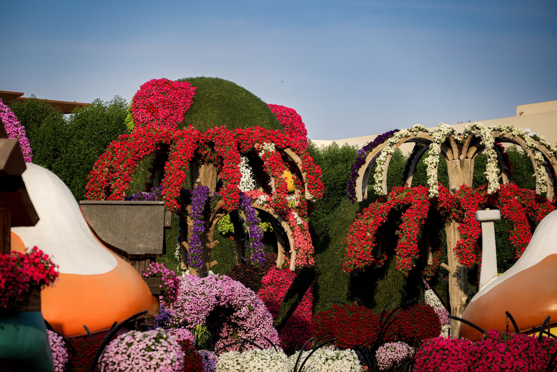 A breathtaking garden with colorful flower arrangements and creative landscaping design.