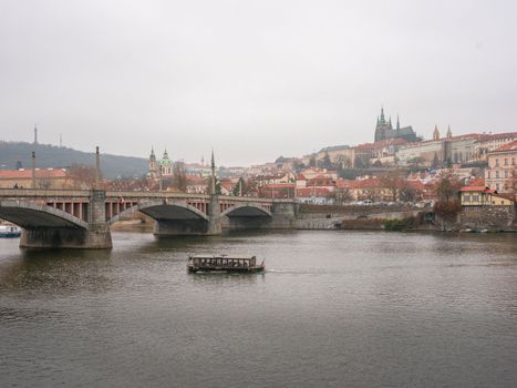 Charles Bridge at sunrise with a photographer — Prague
