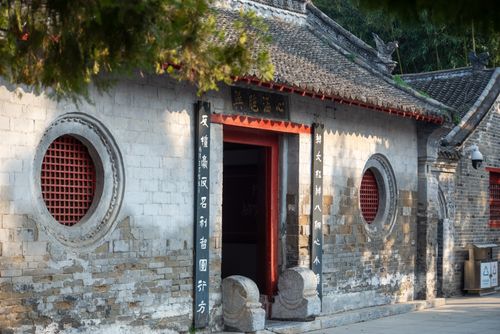 Free Beautiful traditional Asian temple entrance with stone architecture and ornate design details. Stock Photo