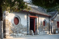 Historic Chinese Temple Entrance with Circular Windows