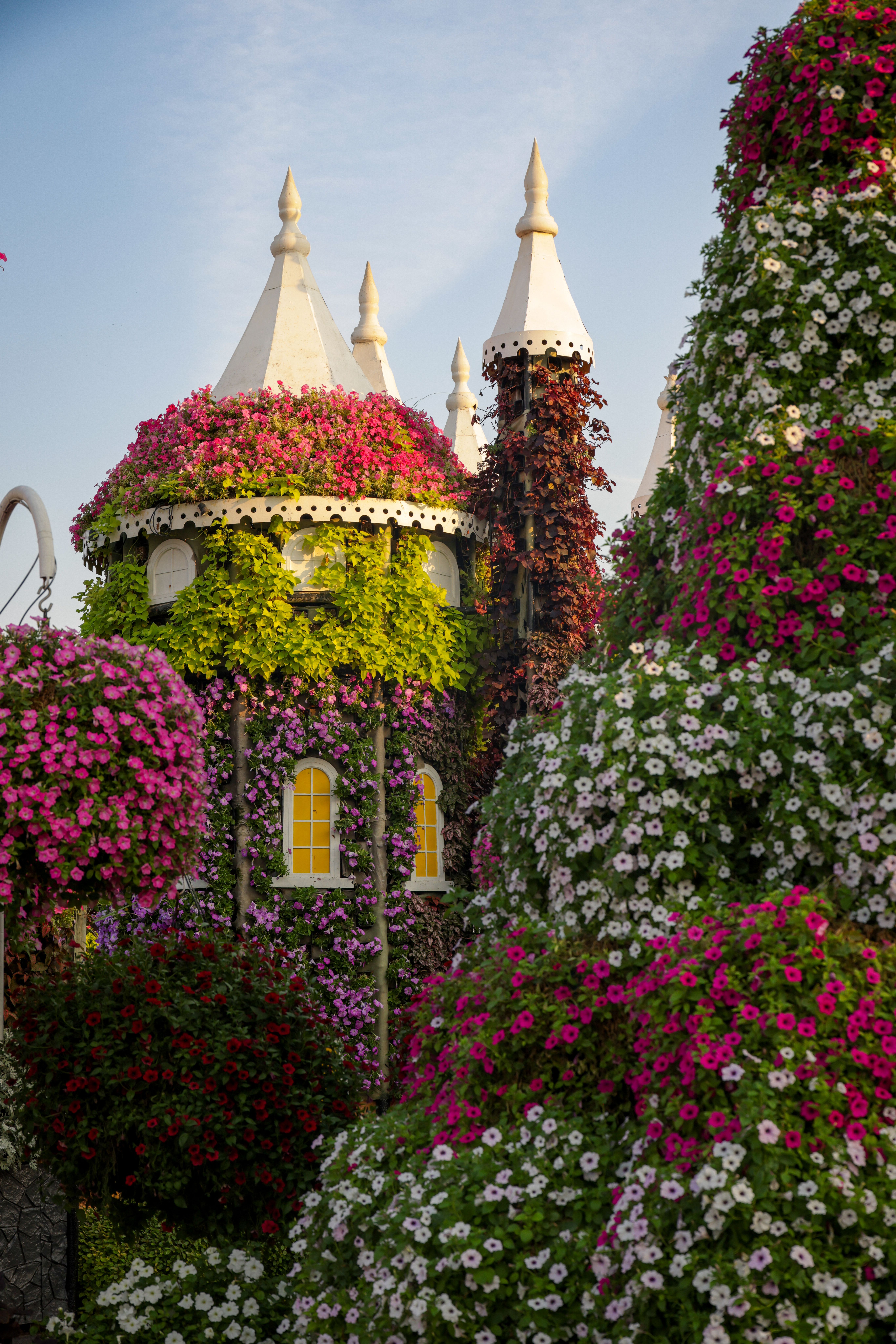Charming Floral Castle in a Vibrant Garden · Free Stock Photo