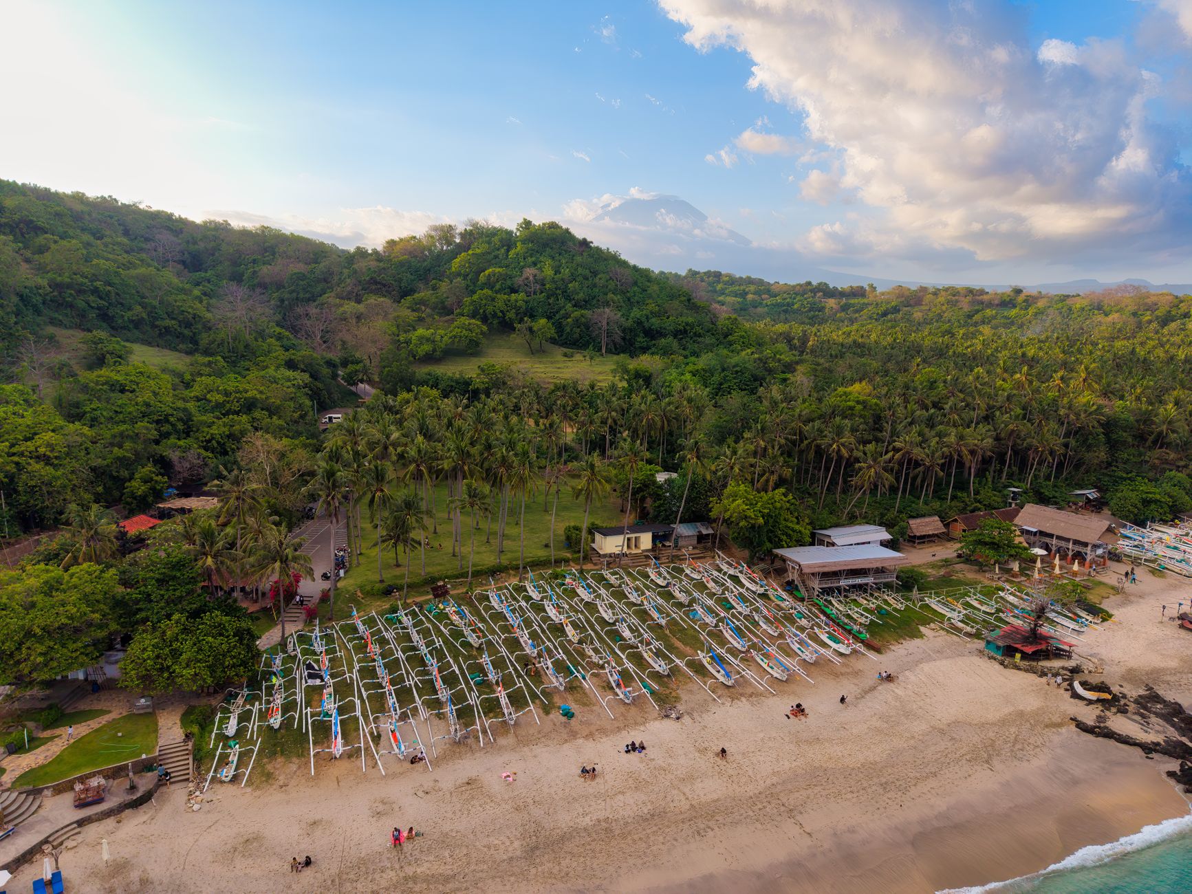 Solitary walk on a tranquil Bali beach at sunset, capturing serenity and natural beauty.