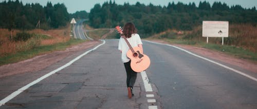 Free stock photo of acoustic guitar, asphalt road, girl