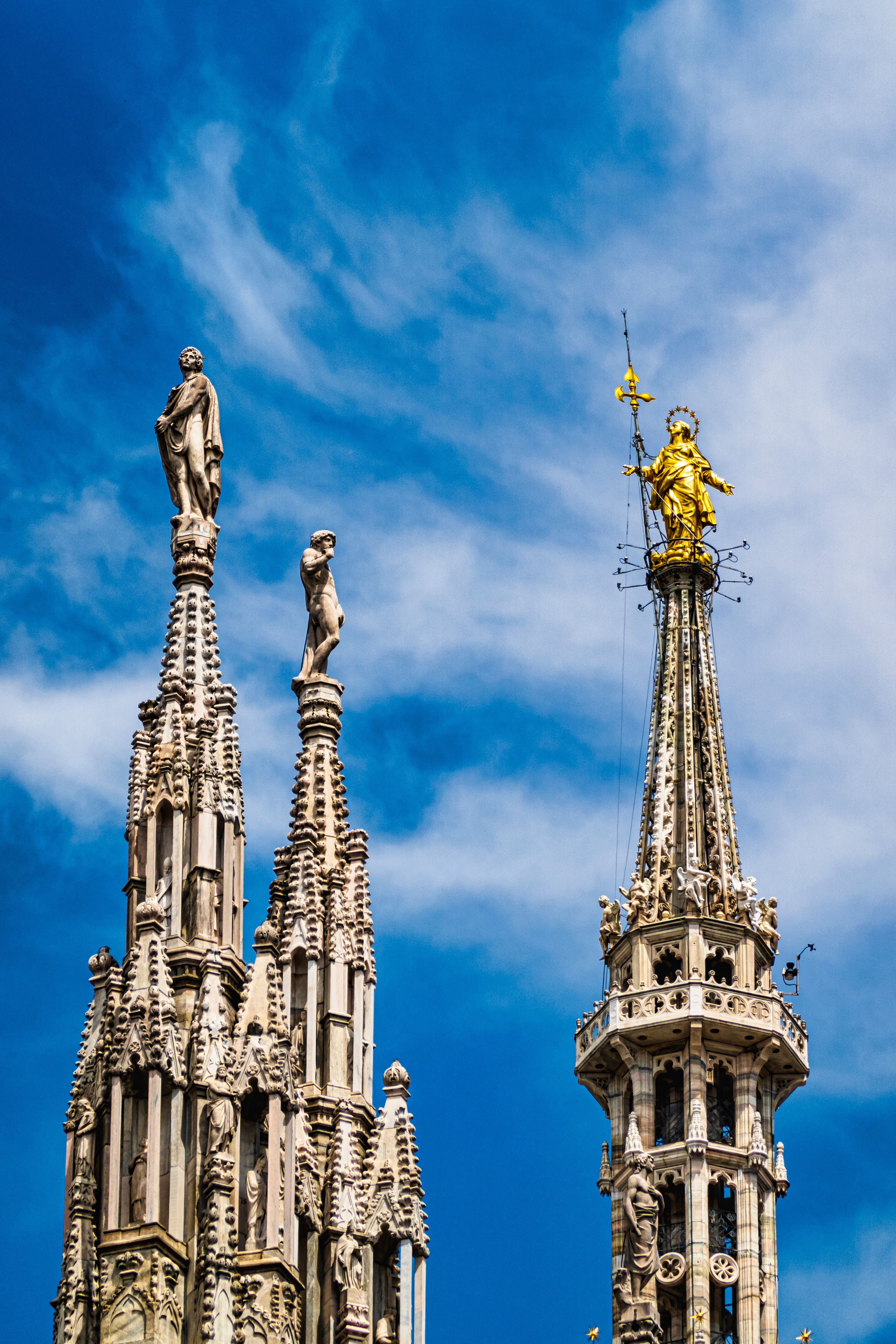 Gothic Spires Against Dramatic Blue Sky · Free Stock Photo