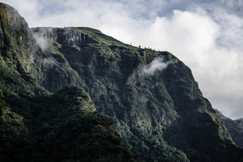 Free Majestic mountain scenery in Madeira, Portugal with rolling fog and lush greenery. Stock Photo